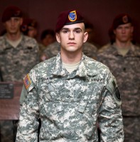 Pvt. Charlie Shaw stands at attention for the crowd following his first donning of the maroon beret during the Enlisted Green Platoon- Combat Skills graduation ceremony, Feb. 18, 2014, at Fort Campbell, Ky. Pvt. Shaw, a second generation Night Stalker, attended Green Platoon as part of the assessment process aspiring Soldiers must endure before joining the 160th Special Operations Aviation Regiment (Airborne). (160th SOAR (Airborne) courtesy photo)