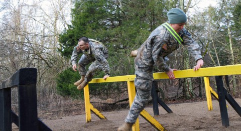 Competitors assigned to 3rd Brigade Combat Team “Rakkasans,” 101st Airborne Division (Air Assault), jump over barriers at The Sabalauski Air Assault School during the ‘Best Rakkasan’ competition  here, Feb. 19, 2014. The competition was held was the first of its kind and was designed to measure the overall proficiency of selected teams and award them with the title of ‘Best Rakkasan’ through competitive events. (Sgt. Brian Smith-Dutton/U.S. Army)