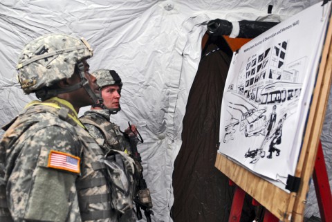 1st Lt. Andre Shinda and Staff Sgt. Robert Herendeen, both assigned to 3rd Battalion, 187th Infantry Regiment, 3rd Brigade Combat Team “Rakkasans,” 101st Airborne Division (Air Assault), memorize a picture during the ‘Best Rakkasan’ competition mystery event here, Feb. 20, 2014. The competition was held was the first of its kind and was designed to measure the overall proficiency of selected teams and award them with the title of ‘Best Rakkasan’ through competitive events. (Sgt. Brian Smith-Dutton/U.S. Army)