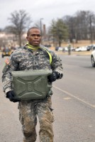 1st Lt. Andre Shinda from Company D, 3rd Battalion, 187th Infantry Regiment, 3rd Brigade Combat Team “Rakkasans,” 101st Airborne Division (Air Assault), carries a five-gallon water jug during the final event of the ‘Best Rakkasan’ competition on Feb. 20, 2014. (Staff Sgt. Joel Salgado/U.S. Army)