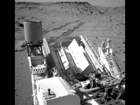 NASA's Curiosity Mars rover used the Navigation Camera (Navcam) on its mast to catch this look-back eastward at wheel tracks from driving through and past "Dingo Gap" inside Gale Crater. (NASA/JPL-Caltech)