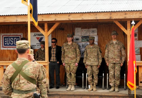 Col. Peter Benchoff (left to right), commander of 2nd Brigade Combat Team, 101st Airborne Division, Task Force Strike, Brig. Gen. Carl Alex, commander of Tactical Advise and Asset Command Northeast, and Col. Mario Diaz, commander of 4th Brigade 10th Mountain Division, Task Force Patriot, stand at attention during a transfer of authority ceremony March 3, 2014 at Forward Operating Base Gamberi. (Sgt. David Cox/U.S. Army)