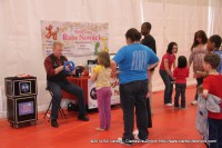 Russ Nowack from Hocus-Pocus Entertainment making baloon animals for Mega Party attendees