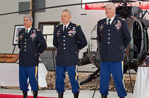 Chief Warrant Officer 5 George "Billy" Cook and Chief Warrant Officer 5 Karl H. Maier stand with Col. John R. Evans Jr., 160th Special Operations Aviation Regiment during a retirement ceremony March 21st at Fort Campbell, Ky. Cook and Maier retired following a combined 70-years of service, with more than 50 years spent as Night Stalkers. (U.S. Army photo)