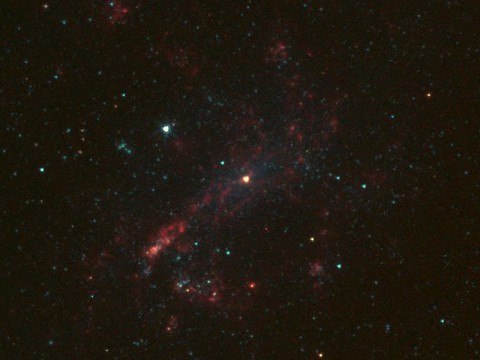 The galaxy NGC 4395 is shown here in infrared light, captured by NASA's Spitzer Space Telescope. (NASA/JPL-Caltech)