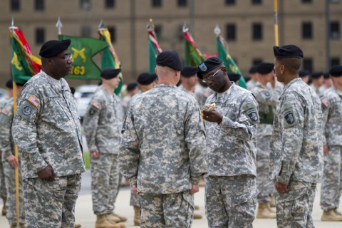 Command Sgt. Maj. Eugene Thomas Jr., a native of Greenville, Fla., inspects the NCO sword during a change of responsibility ceremony April 14, at Fort Campbell, Ky. The sword represents the trust and confidence the Army places in the NCO Corps. (Sgt. Leejay Lockhart/U.S. Army)