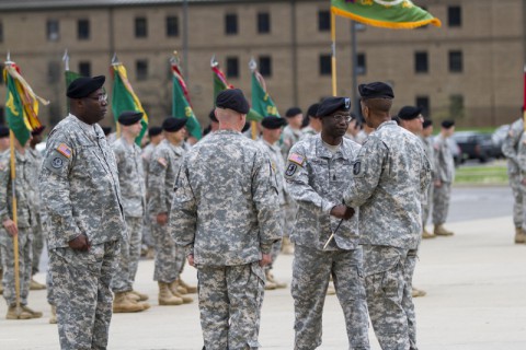 Command Sgt. Maj. Eugene Thomas Jr. passes the NCO sword to Col. Charles Hamilton, the commander of the 101st Sustainment Brigade, during a change of responsibility ceremony April 14, at Fort Campbell, Ky. During the ceremony responsibility for being the senior enlisted adviser to the brigade commander passed from Thomas to Command Sgt. Maj. Ian Griffin. (Sgt. Leejay Lockhart/U.S. Army)