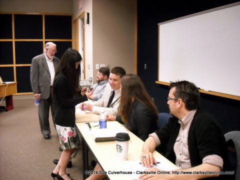 A young lady asks a question of the panel at the Teaching Workshop during the Robert Penn Warren Circle Annual Meeting