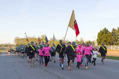 Members of Sgt. 1st Class Charles Lewis Adkins's family proudly wear Run for the Fallen T-shirts as they run at the head of the 101st Special Troops Battalion, 101st Sustainment Brigade, 101st Airborne Division (Air Assault), in the third annual Gamberi Memorial Run April 16, at Fort Campbell. (U.S. Army photo by Sgt. Sinthia Rosario, 101st Sustainment Brigade Public Affairs)