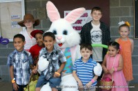 A family poses for a photo with the Easter Bunny at the City of Clarksville’s 2014 Spring Eggstravaganza