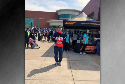 Russ Shemberger of RPM Massage in Clarksville accepts his second-place age group award at the sixth annual Alpha Delta Pi Sprint Triathlon held Sunday, April 6 at Middle Tennessee State University in Murfreesboro. 