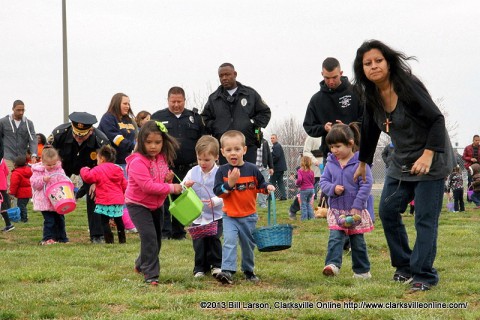 Kids scoop up Easter Eggs during the City of Clarksville's 2013 Spring Eggstravanganza Easter Egg Hunt