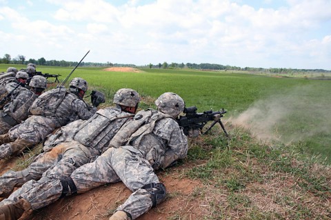 Soldiers with 1st Platoon, Company D, 1st Battalion, 327th Infantry Regiment, 1st Brigade Combat Team, 101st Airborne Division (Air Assault), provide suppressive fire during a walk and shoot exercise May 8, 2014, near Observation Post 13 at Fort Campbell, Ky. (Sgt. Jon Heinrich)