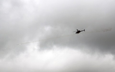 An OH-58 Kiowa helicopter fires a rocket while providing close air support during a walk and shoot exercise for Company B, 2nd Battalion, 327th Infantry Regiment, 1st Brigade Combat Team, 101st Airborne Division (Air Assault), May 9, 2014, near Observation Post 13 at Fort Campbell, Ky. (Sgt. Jon Heinrich)