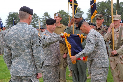 Maj. Gen. James C. McConville (left), commanding general, 101st Airborne Division (Air Assault), looks on as Col. Val C. Keaveny, Jr. (center), former commander, 4th Brigade Combat Team, 101st Abn. Div., and Command Sgt. Maj. Franklin Velez, command sergeant major of 4th BCT, 101st Abn. Div., fold the brigade colors prior to casing them during the inactivation and relinquishment of command ceremony at the division parade field at Fort Campbell, KY, April 25th, 2014. (U.S. Army photo by Sgt. Justin A. Moeller, 4th BCT Public Affairs)