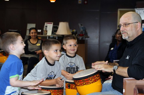 Bob Stagner, a volunteer from the state organization on art and disability VSA Tennessee, teaches children how to communicate through music during a percussion session May 15, 2014 at the Fort Campbell Soldier and Family Assistance Center. "From the children to the Soldiers, everyone felt a great connection and that's what it was all about," said Michell McGilvery, the Child, Youth and School Service liaison for the Fort Campbell Warrior Transition Battalion. (U.S. Army photo by Sgt. Eric Lieber)