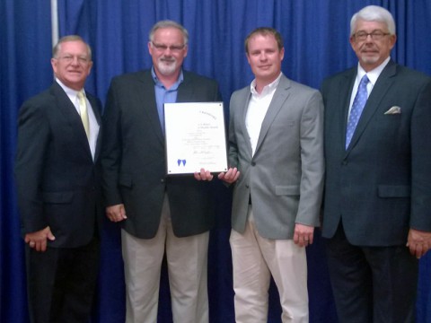 (Middle) Jon McGraw, customer service manager for Campbell Crossing, and Brian Egbert, project EH&S manager for Campbell Crossing, accept the 2013-2014 Kentucky Governor’s Safety and Health Award at the 30th Annual Governor’s Safety and Health Conference.