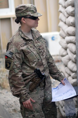 U.S. Army Capt. Samantha Reid, preventive medicine officer with Company C, 526th Brigade Support Battalion, 2nd Brigade Combat Team, 101st Airborne Division (Air Assault), prepares to set a bug trap for sample collection at Forward Operating Base Gamberi, Afghanistan, May 17, 2014. (U.S. Army photo by Sgt. David Cox, 2nd Brigade Combat Team Public Affairs)