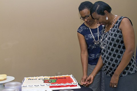 Regina Hamilton and Sandra Smith, both military spouses and volunteers for the 101st Sustainment Brigade (Lifeliners), 101st Airborne Division (Air Assault), cut a cake during a volunteer appreciation ceremony hosted by the Lifeliners brigade, May 8, 2014, at Fort Campbell, KY. (U.S. Army photo by Sgt. Sinthia Rosario, 101st Sustainment Brigade Public Affairs)