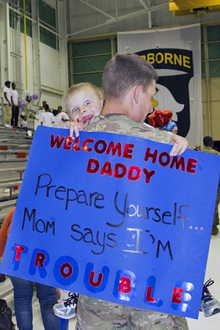 Sgt. Kyle Strey, a native of Toledo, Ohio and a maintenance and retention NCO with the 227th Quartermaster Company, 129th Combat Sustainment Support Battalion, 101st Sustainment Brigade, 101st Airborne Division (Air Assault), embraces his son Owen, 4, during a welcome home ceremony May 4, at Fort Campbell.  (U.S. Army photo by Sgt. 1st Class Mary Rose Mittlesteadt, 101st Sustainment Brigade Public Affairs)