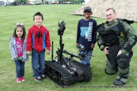 A EOD Technician shows the kids the tricks of his trade