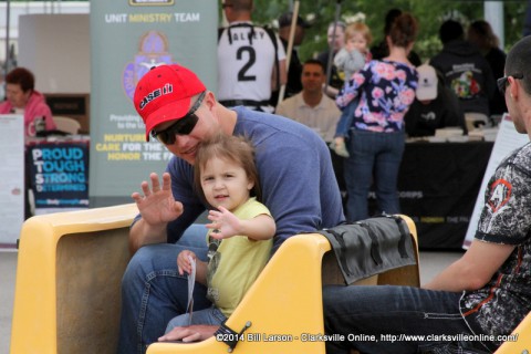 A young lady and her father enjoy the trackless train at the 2014 Week of the Eagles Spectacular Saturday Community Fair