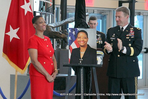 Valerie Hunter-Kelly receives the acclaim of the audience after her portrait photograph is unveiled. 