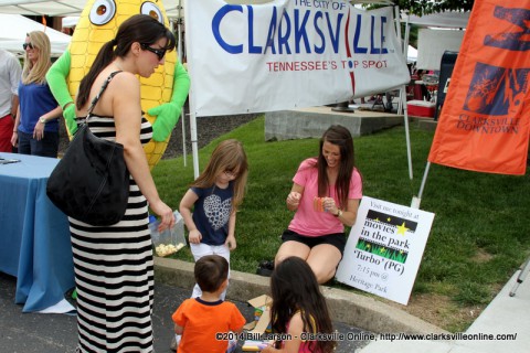 Candice Tillman from the Clarksville Department of Parks and Recreation helps kids do some arts and crafts