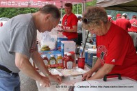 Members of the Governor's Club chopping onions for the Weigh-In