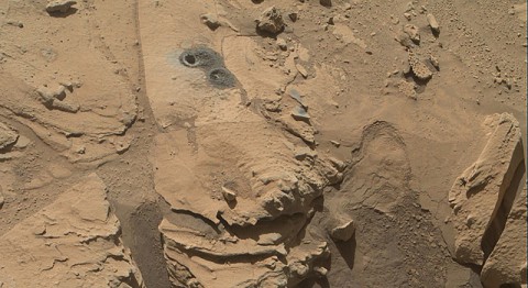 This May 12, 2014, view from the Mars Hand Lens Imager (MAHLI) in NASA's Curiosity Mars Rover shows the rock target "Windjana" and its immediate surroundings after inspection of the site by the rover by drilling and other activities. (NASA/JPL-Caltech/MSSS) This May 12, 2014, view from the Mars Hand Lens Imager (MAHLI) in NASA's Curiosity Mars Rover shows the rock target "Windjana" and its immediate surroundings after inspection of the site by the rover by drilling and other activities. (NASA/JPL-Caltech/MSSS)