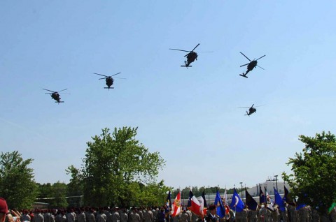 A formation of MH-60M Black Hawks from the 1st Battalion, 160th Special Operations Aviation Regiment (Airborne) conduct the ceremonial Missing Man flyover during the annual Week of Night Stalker Activities Memorial Ceremony held at Fort Campbell, Ky., May 21, 2014. (U.S. Army photo by Maj. Allen Hill, 160th SOAR Public Affairs)