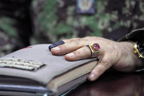 Maj. Gen. Mohammed Zaman Wazeri, the commander of the 201st Corps Afghan National Army, displays is inked index finger that symbolizes his participation in the Afghan national runoff election at Forward Operating Base Gamberi in Laghman province, June 14, 2014. (Sgt. David Cox, 2nd Brigade Combat Team Public Affairs)