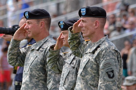 Maj. Gen. James C. McConville (left), outgoing commanding general, 101st Airborne Division (Air Assault), Gen. Daniel B. Allyn (center), commanding general, U.S. Army Forces Command, and Maj. Gen. Gary J. Volesky (right), incoming commanding general, 101st Airborne Division (Air Assault), salute during the playing of the national anthem during a change of command ceremony, June 20, 2014, at Fort Campbell, Ky. (U.S. Army photo by Larry Noller)