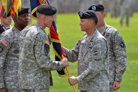 Maj. Gen. Gary J. Volesky (left), incoming commanding general, 101st Airborne Division (Air Assault), receives the division colors from Gen. Daniel B. Allyn (center), commanding general, U.S. Army Forces Command, during a change of command ceremony, June 20, 2014, at Fort Campbell, Ky. (U.S. Army photo by Larry Noller)