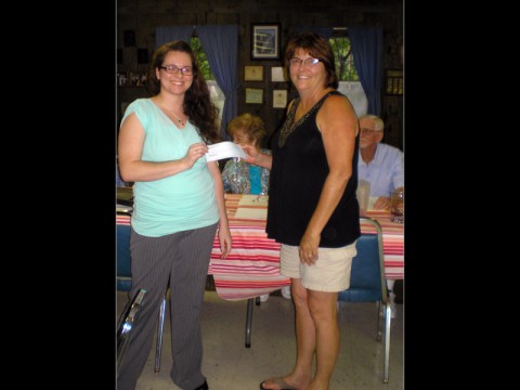 Meghan Gattignolo (left), who is studying German at Austin Peay State University, receives a scholarship from Debbie Whitaker (right), president of the Clarksville Edelweiss Club.