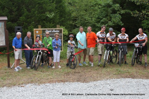 The ribbon was cut by Clarksville Mayor Kim McMillan, Clarksville Department of Parks And Recreation Director Mark Tummons, City Councilman Gino Grubbs, Drew Sanford who led the construction, along with members of the COGS Mountain Bike Club who provided volunteer manpower.