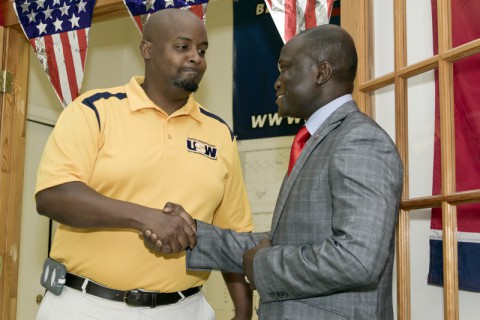 Credo Amouzouvil (Right) shakes hands with Mike A. Padgett III, President of the United  Steelworkers of America, District 9 Local 501-G union after officially receiving their endorsement