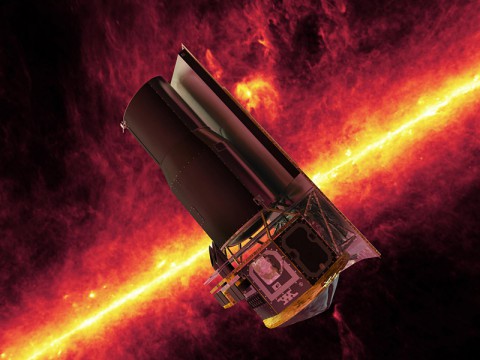 The Spitzer Space Telescope whizzes in front of a brilliant, infrared view of the Milky Way galaxy's plane in this artistic depiction. (NASA/JPL-Caltech)