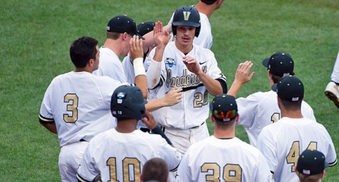 Vanderbilt Commodores outfielder Bryan Reynolds (20) celebrates with teammates after scoring against the UC Irvine Anteaters during game six of the 2014 College World Series at TD Ameritrade Park Omaha. (Steven Branscombe-USA TODAY Sports)