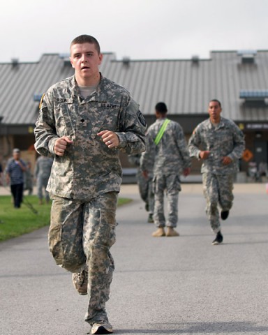 Spc. Brandon D. Rollins, a support operations helpdesk technician with Headquarters and Headquarters Company, 101st Special Troops Battalion, 101st Sustainment Brigade, 101st Airborne Division (Air Assault), sprints around the brigade quad during the 101st STB's inaugural Warrior Challenge July 2, at Fort Campbell. (U.S. Army photo by Sgt. Leejay Lockhart)