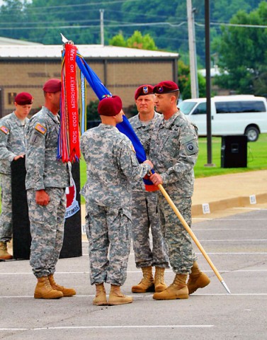 Brig. Gen. Erik Peterson, Commander, United States Army Special Operations Aviation Command, passes the regiment colors to Col. Michael H. Hertzendorf during the 160th Special Operations Aviation Regiment (Airborne) change of command ceremony held at the Gen. Bryan Brown Compound, Fort Campbell, KY, June 27, 2014. Hertzendorf assumed command of the regiment from the outgoing commander, Col. John R. Evans, Jr. (U.S. Army photo)