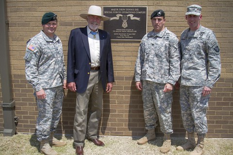 (L to R) Col. John W. Brennan, commander of the 5th Special Forces Group (Airborne), retired Maj. Drew Dix, Medal of Honor recipient and former member of the 5th SFG(A), Lt. Col. Joseph Lock, commander of 4th Battalion, 5th SFG(A) and Maj. Gen. Gary J. Volesky, commander of the 101st Airborne Division (Air Assault), stand in front of the plaque dedicating the 4th Bn. special operations complex to Dix, after a ceremony held here July 11, 2014. (Sgt. Justin A. Moeller)