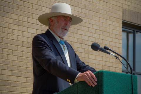 Retired U.S. Army Maj. Drew Dix, Medal of Honor recipient and former member of the 5th Special Forces Group(A), gives a speech during a ceremony held here, July 11, 2014, dedicating the 4th Bn. special operations complex in Dix’s name. (Sgt. Justin A. Moeller)