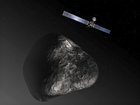 This artist's impression shows the Rosetta orbiter at comet 67P/Churyumov-Gerasimenko. The image is not to scale. (ESA/ATG Medialab)