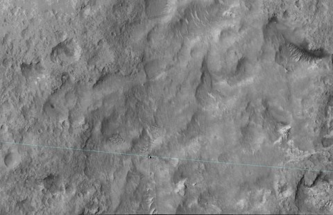 This June 27, 2014, image from the HiRISE camera on NASA's Mars Reconnaissance Orbiter shows NASA's Curiosity Mars rover on the rover's landing-ellipse boundary, which is superimposed on the image. The 12-mile-wide ellipse was mapped as safe terrain for its 2012 landing inside Gale Crater. (NASA/JPL-Caltech/Univ. of Arizona)