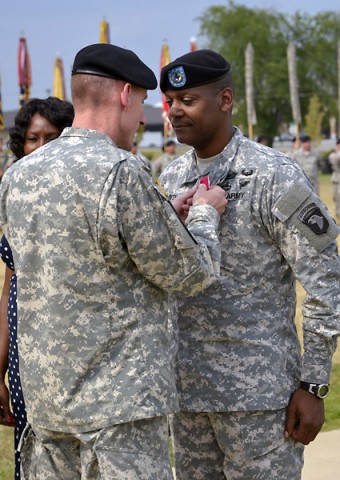 Maj. Gen. Gary J. Volesky, the commanding general of the 101st Airborne Division (Air Assault) and Fort Campbell, awards a Legion of Merit medal to Command Sgt. Maj. Alonzo J. Smith, the senior enlisted advisor of the 101st, today during a relinquishment of responsibility ceremony held in front of the division headquarters here. (Jerry Woller)