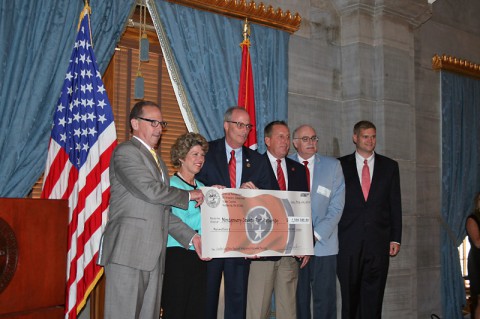 Clarksville Mayor Kim McMillan accepts CMAQ Grant check. Clarksville Mayor Kim McMillan accepts CMAQ Grant check.