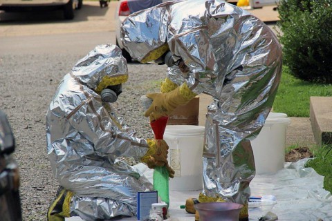 Drug Task Force Agents process methamphetamine lab components at a lab found on Baltimore Drive today.