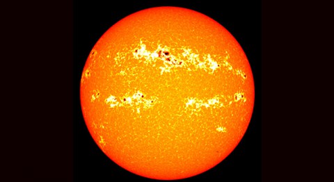 Dark sunspots and bright areas around them called faculae, visible in this 2001 solar image, cause most of the variation in total solar irradiance. (NASA/GSFC/SVS)