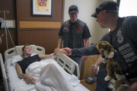 A Soldier with the 5th Special Forces Group (Airborne), shakes the hand of a patient of the Children’s Hospital at TriStar Centennial of Nashville, Sept. 26, 2014, while conducting a “teddy bear run.” The Soldiers rode from Fort Campbell to deliver teddy bears to the patients of the hospital in an attempt to brighten their day. (U.S. Army photo by Sgt. Justin A. Moeller, 5th SFG (A) Public Affairs)